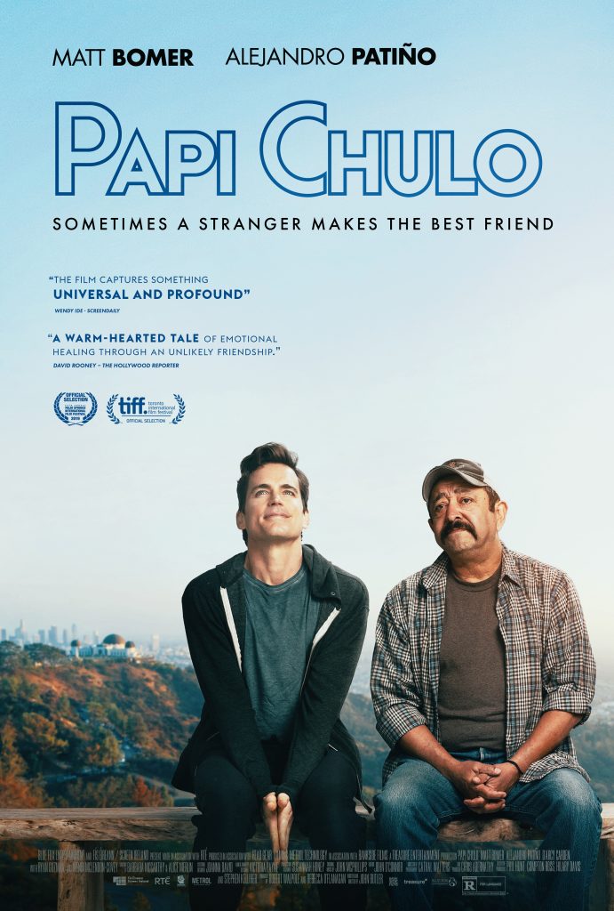 Poster for Papi Chulo, with the tag line "Sometimes a stranger makes the best friend" prominently under the film's title. In the lower half of the poster, two men sit side by side on a balcony railing that overlooks the hills and skyline of Los Angeles. The man on the left is younger and white, wearing a t-shirt and hoodie, pressing his hands together while he looks toward the sky. The man on the right is older and Latino, with a mustache, wearing a plaid button-down shirt and a baseball cap, and looking ahead into the distance. 